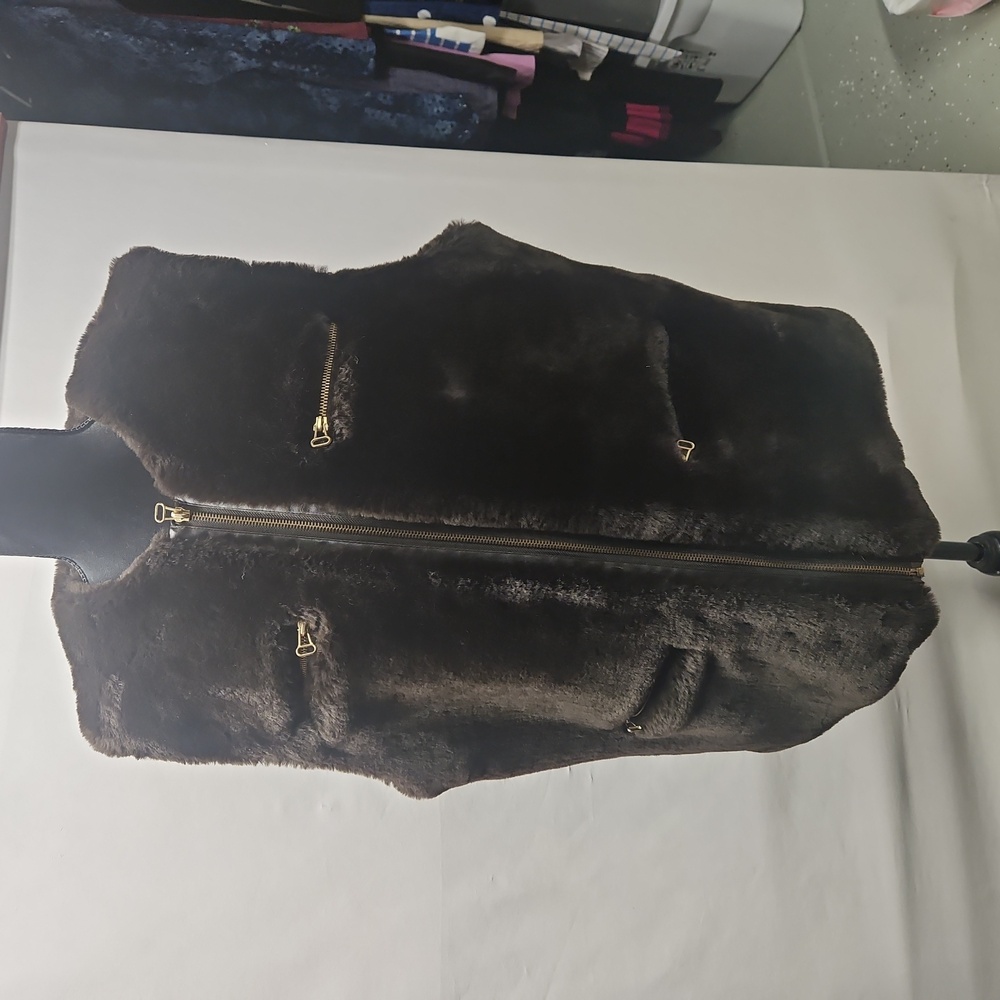 Fully lined vest made of fake brown fur.